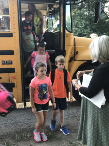 Students exiting a school bus