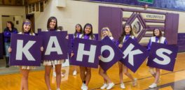 Collinsville cheerleaders with K-A-H-O-K-S signs