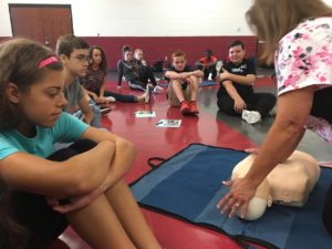 Students watching CPR instruction
