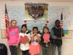 Summit Elementary Students in front of Veterans Day banner