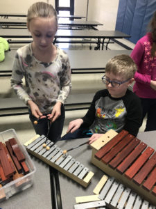 Summit students playing instruments in music class