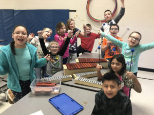 Summit students posing with new music instruments