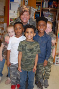 Renfro students and teacher wearing camo