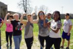 Participants in Kahoks United Boot Camp show strength