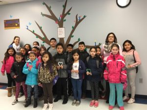 Kreitner students and staff standing in front of the Kindness Tree