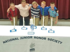 Students by NJHS Ceremony Table