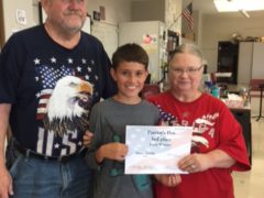 Student Elliott Schusky with James and Kathy Conn representing the VFW