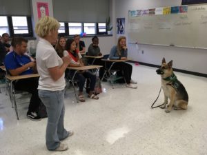 Recon and Nicole Lanahan demonstrate support dog work
